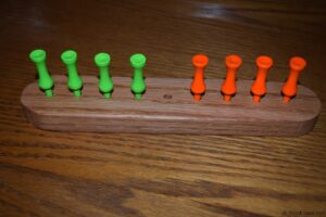 Eight Frogs on a Log Peg Game
